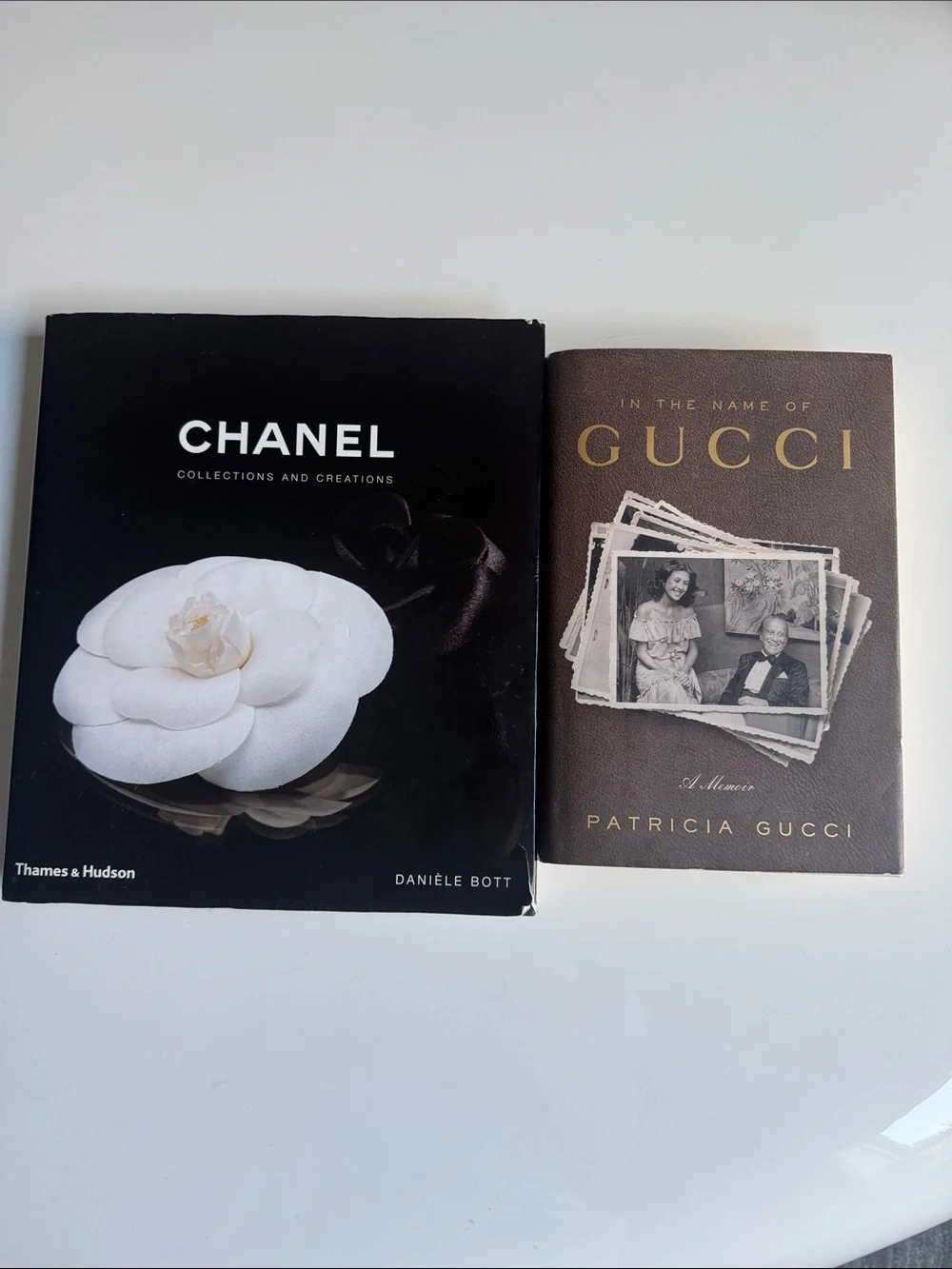 CHANEL Black Cover Coffee Table Book. GUCCI Brown Cover Coffee Table.